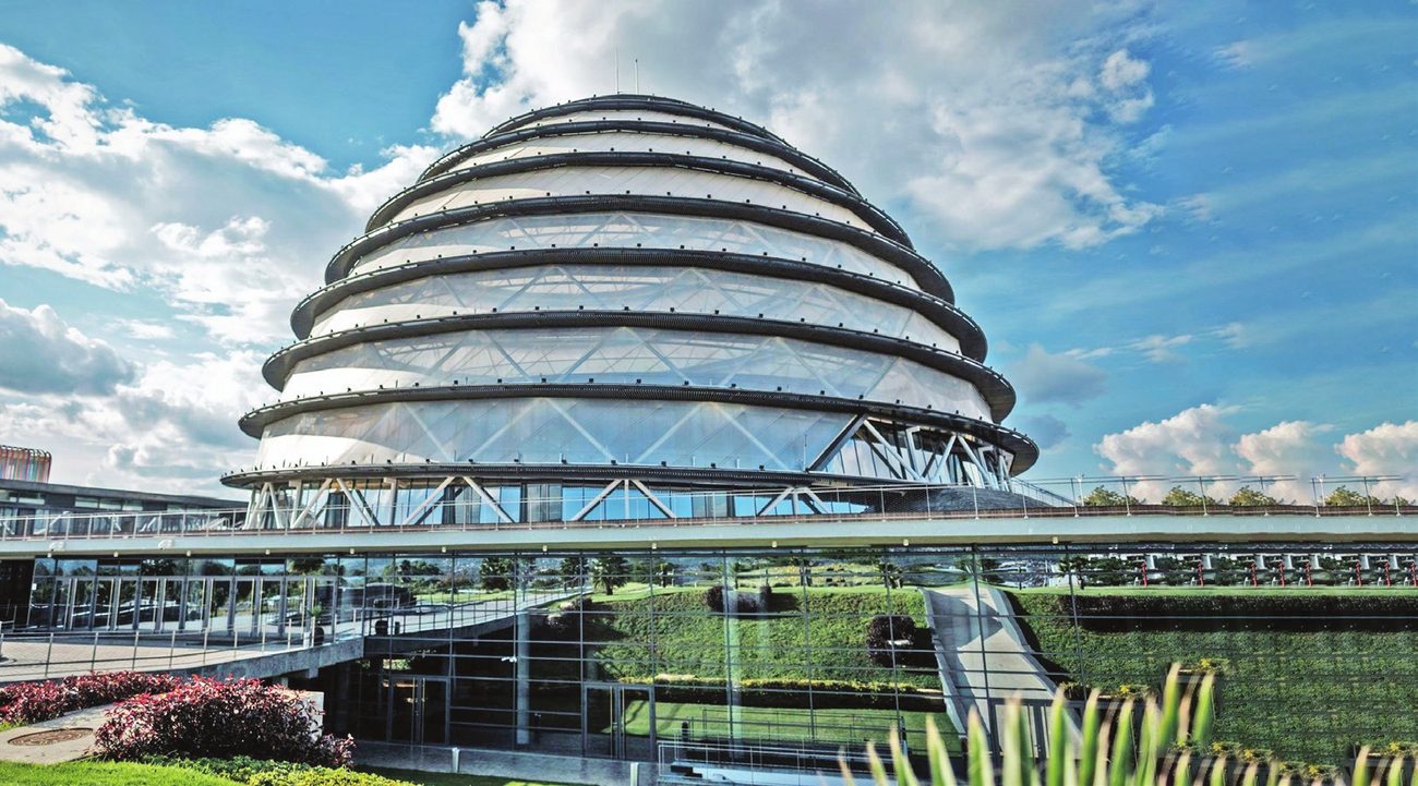Domed convention building with a glazed bridge in the foreground, Kigali